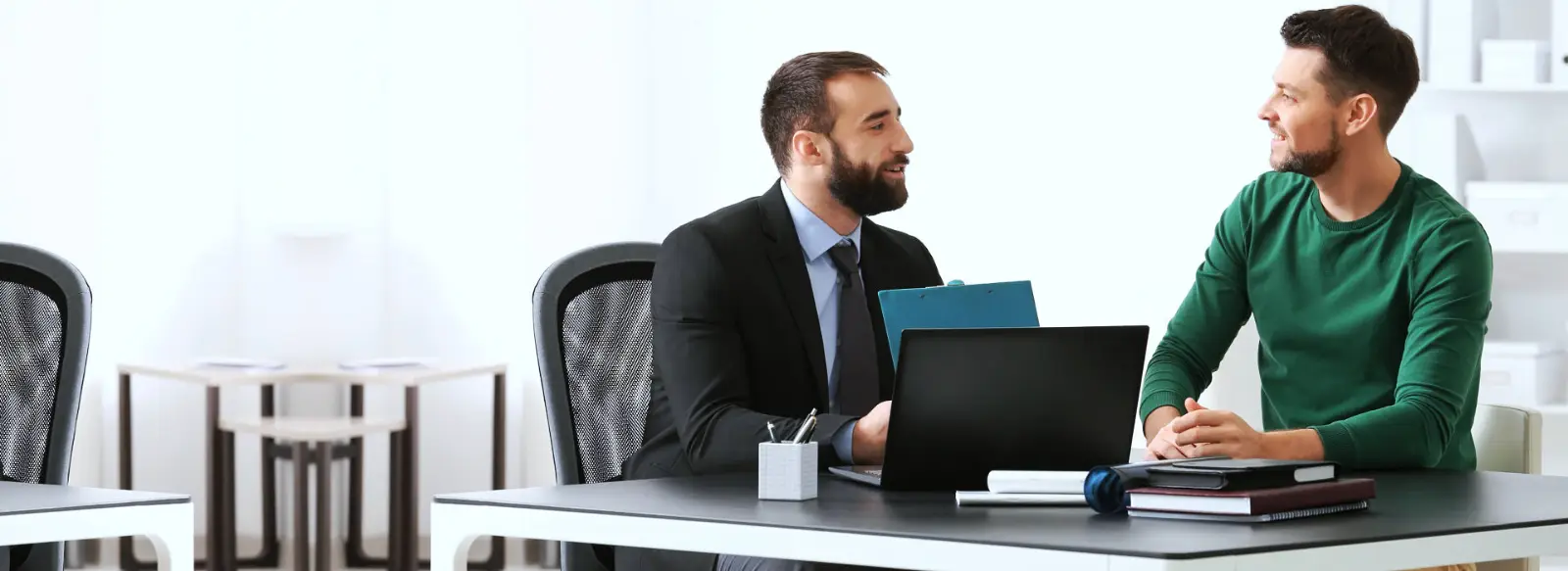 Insurance advisors meeting with a client